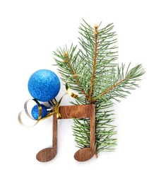 Photo of Composition with Christmas tree branch, decor and wooden music note on white background, top view