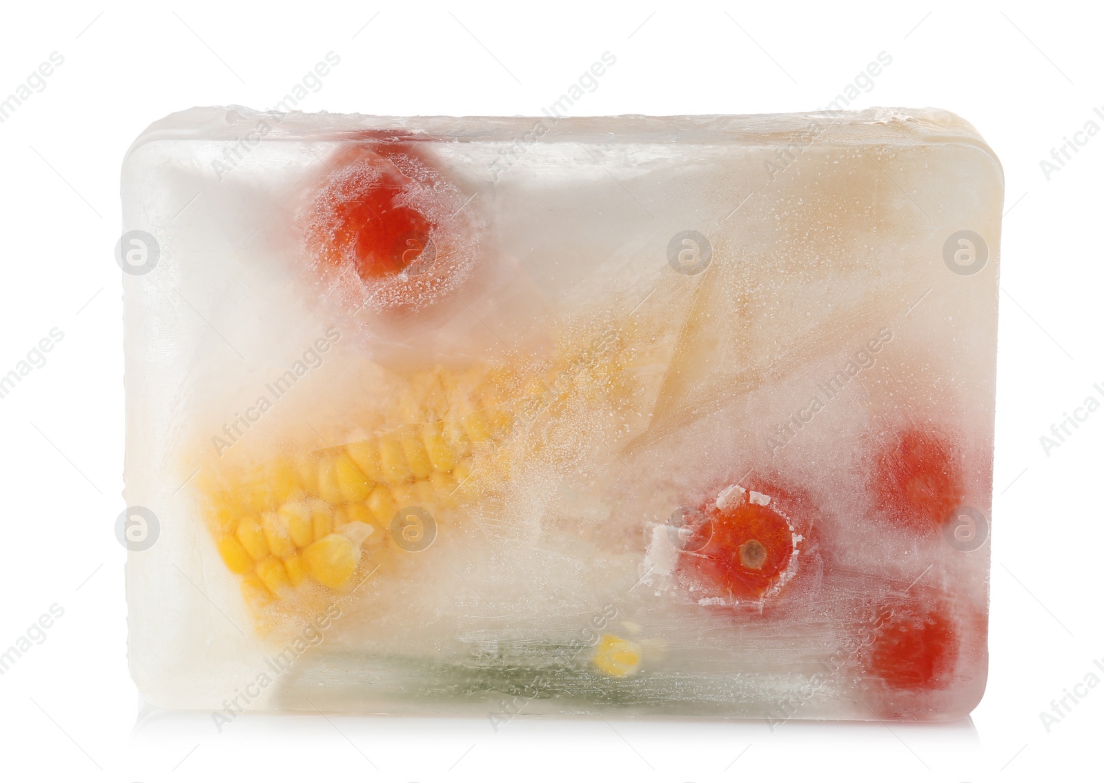 Photo of Fresh vegetables frozen in ice cube on white background