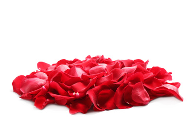 Pile of red rose petals on white background