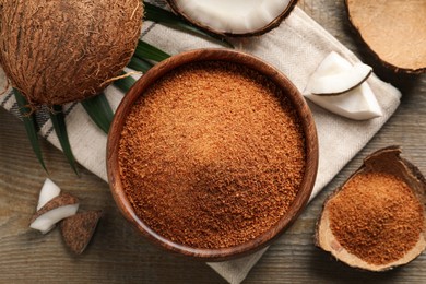 Flat lay composition with natural coconut sugar on wooden table