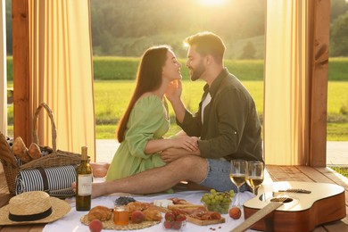 Romantic date. Couple spending time together during picnic on sunny day