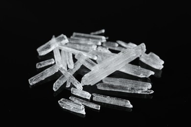 Menthol crystals on black background, closeup view