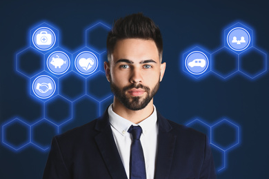 Image of Young man and different icons on dark blue background. Insurance concept