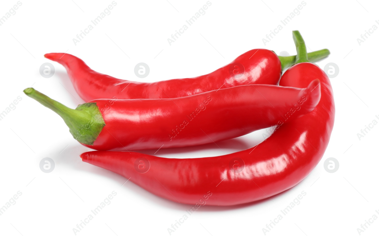 Photo of Red hot chili peppers on white background