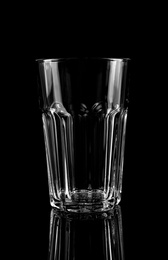 Photo of New clean empty glass on black background