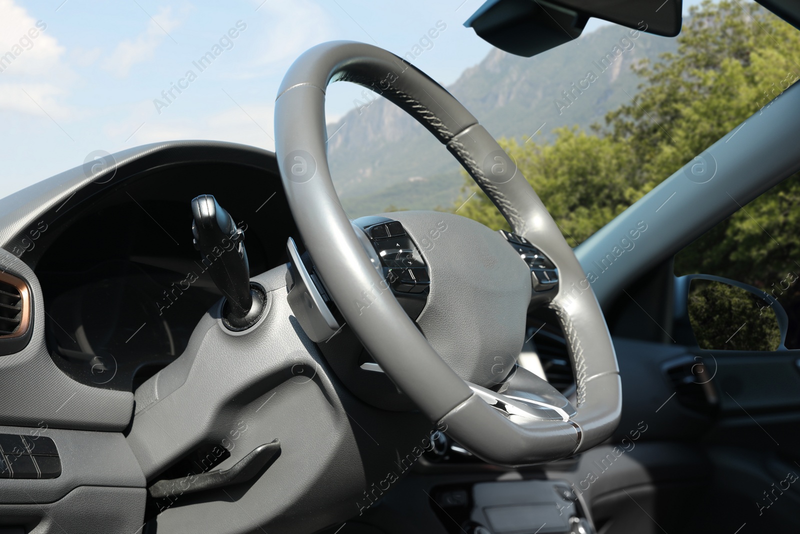 Image of Steering wheel and dashboard in modern car