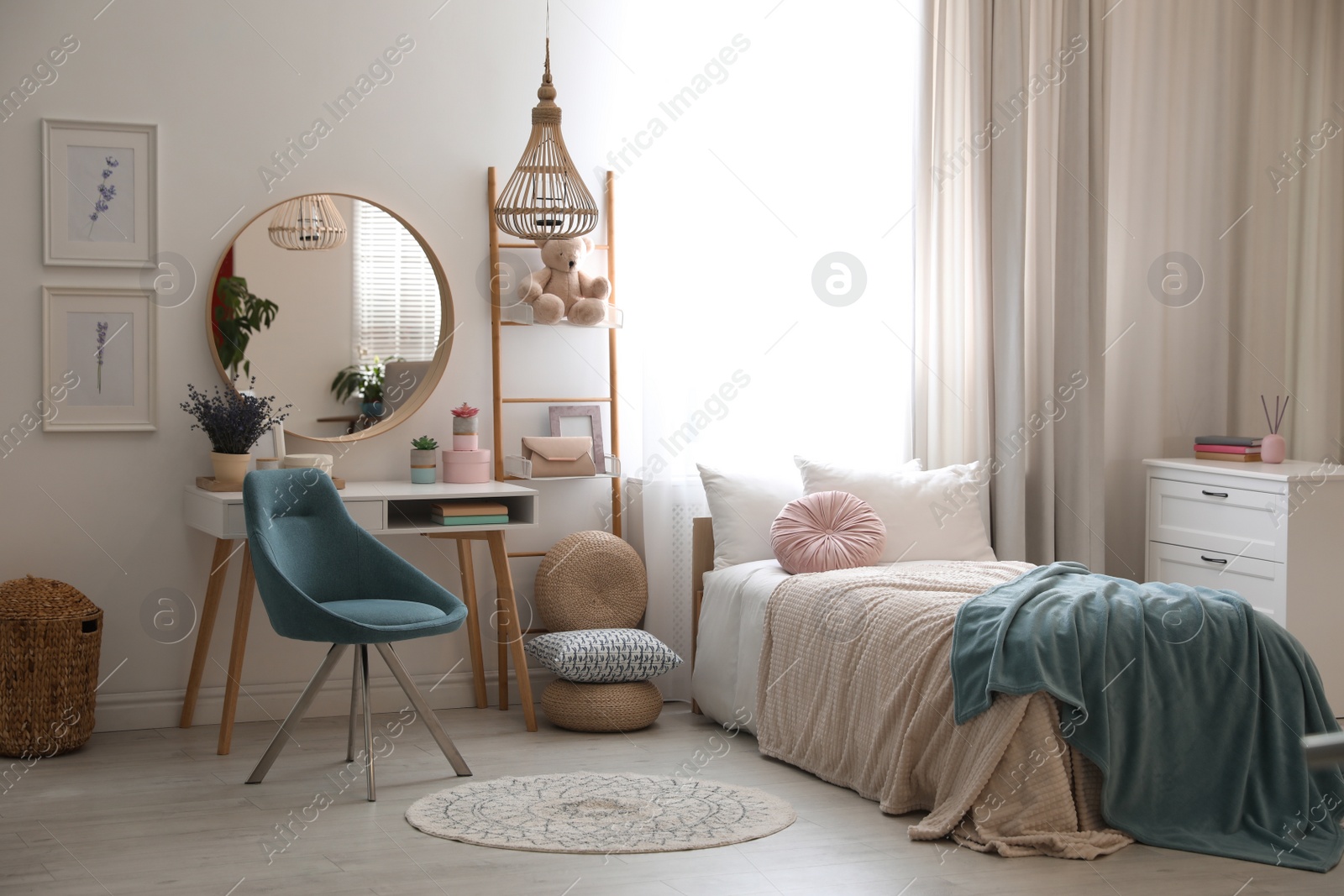 Photo of Teenage girl's bedroom interior with stylish furniture. Idea for design