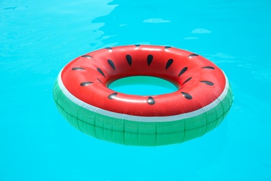 Inflatable ring in swimming pool on sunny day