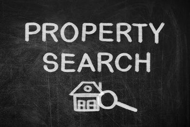 Image of Text Property Search with house and magnifier illustration on black chalkboard