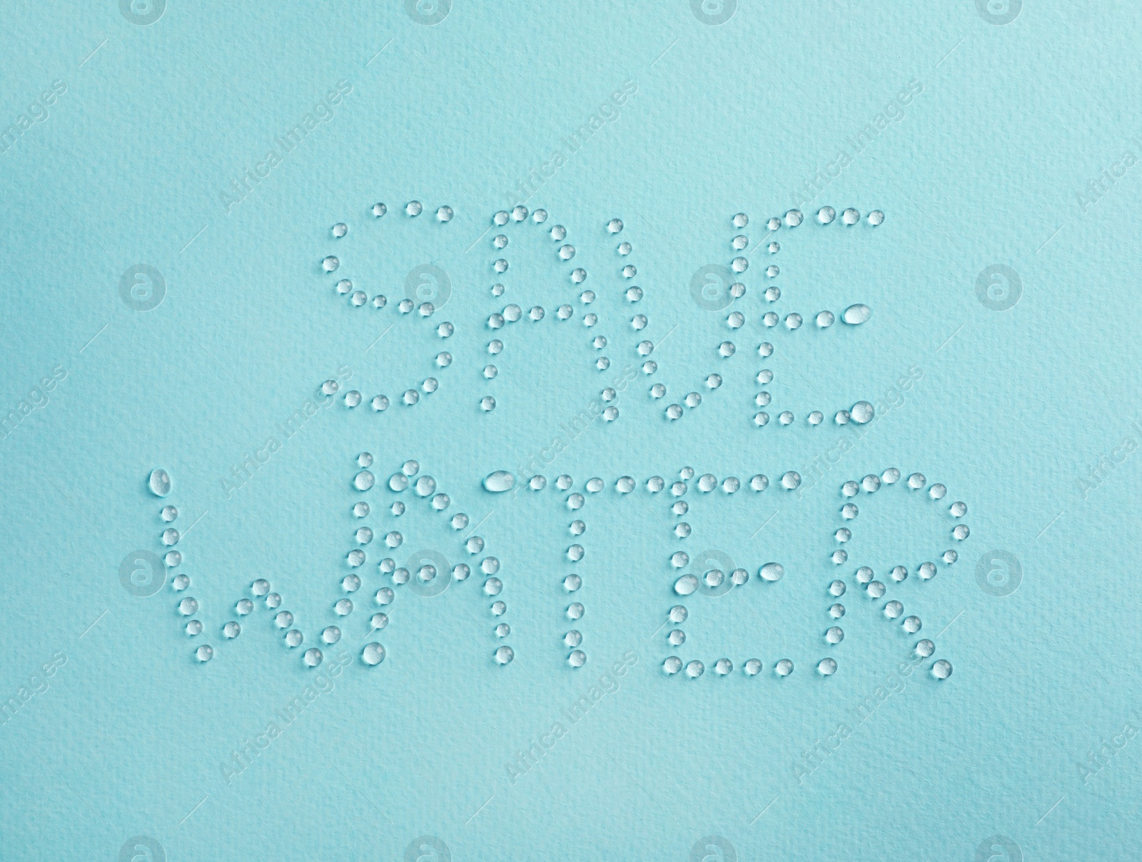 Photo of Inscription Save Water made of drops on light blue background, top view