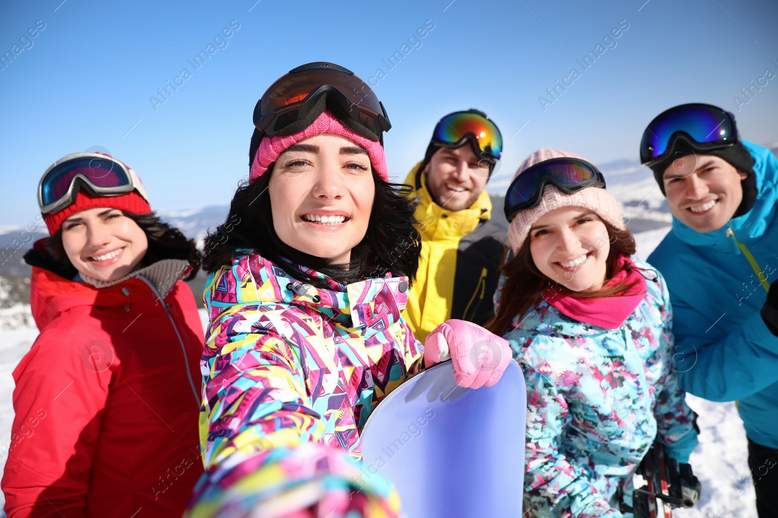 Photo of Group of friends taking selfie outdoors. Winter vacation