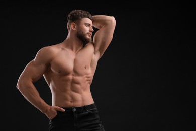 Photo of Handsome muscular man on black background, space for text. Sexy body