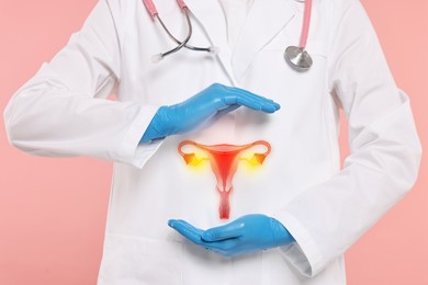 Image of Doctor and illustration of female reproductive system on pink background, closeup
