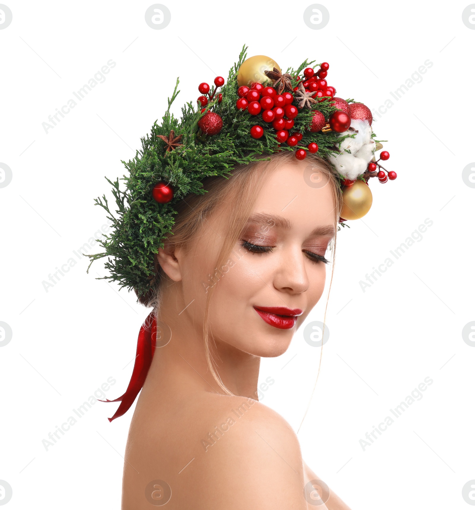 Photo of Beautiful young woman wearing Christmas wreath on white background