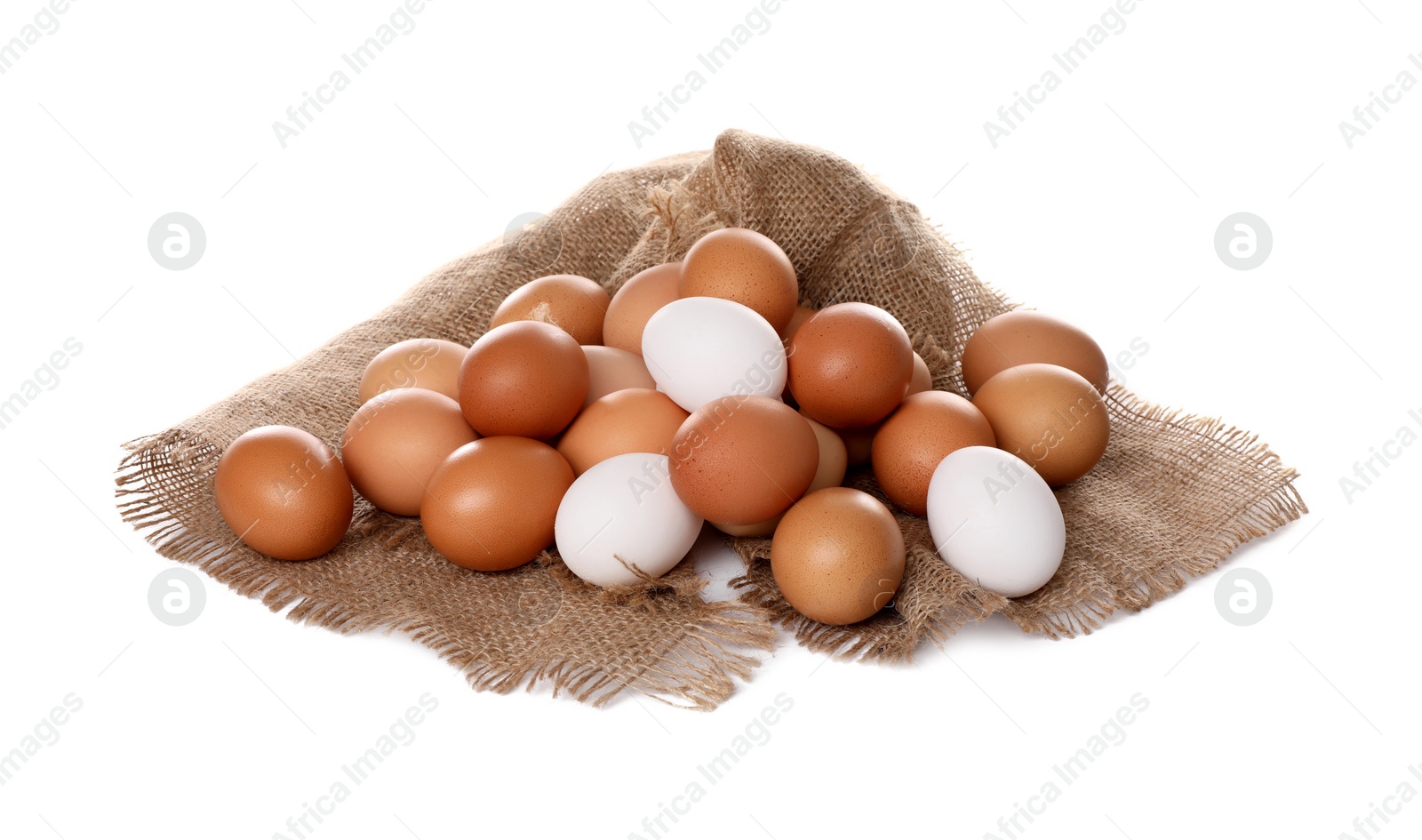 Photo of Fresh chicken eggs and burlap fabric isolated on white