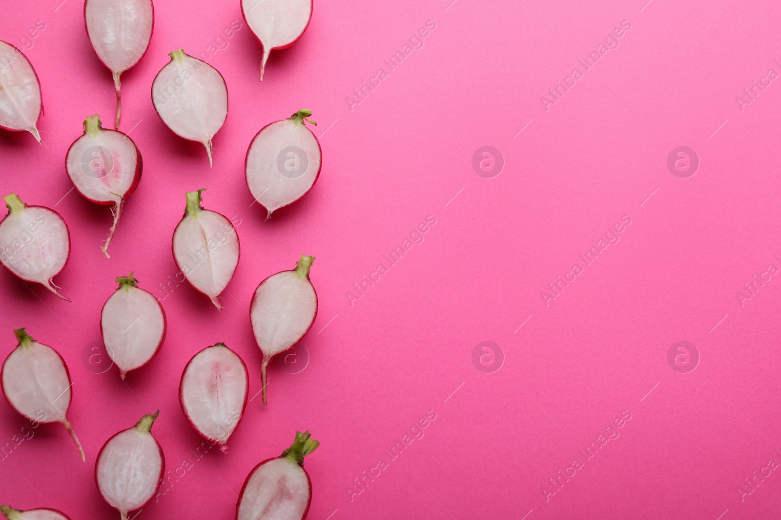 Photo of Fresh ripe radish on pink background, flat lay. Space for text