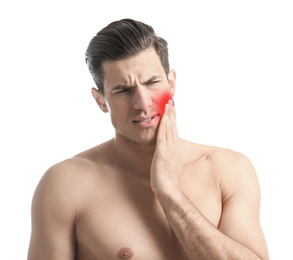 Man suffering from toothache on white background