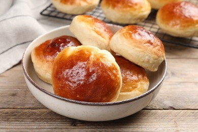 Photo of Tasty scones prepared on soda water on wooden table