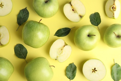 Photo of Flat lay composition of fresh ripe green apples on yellow background