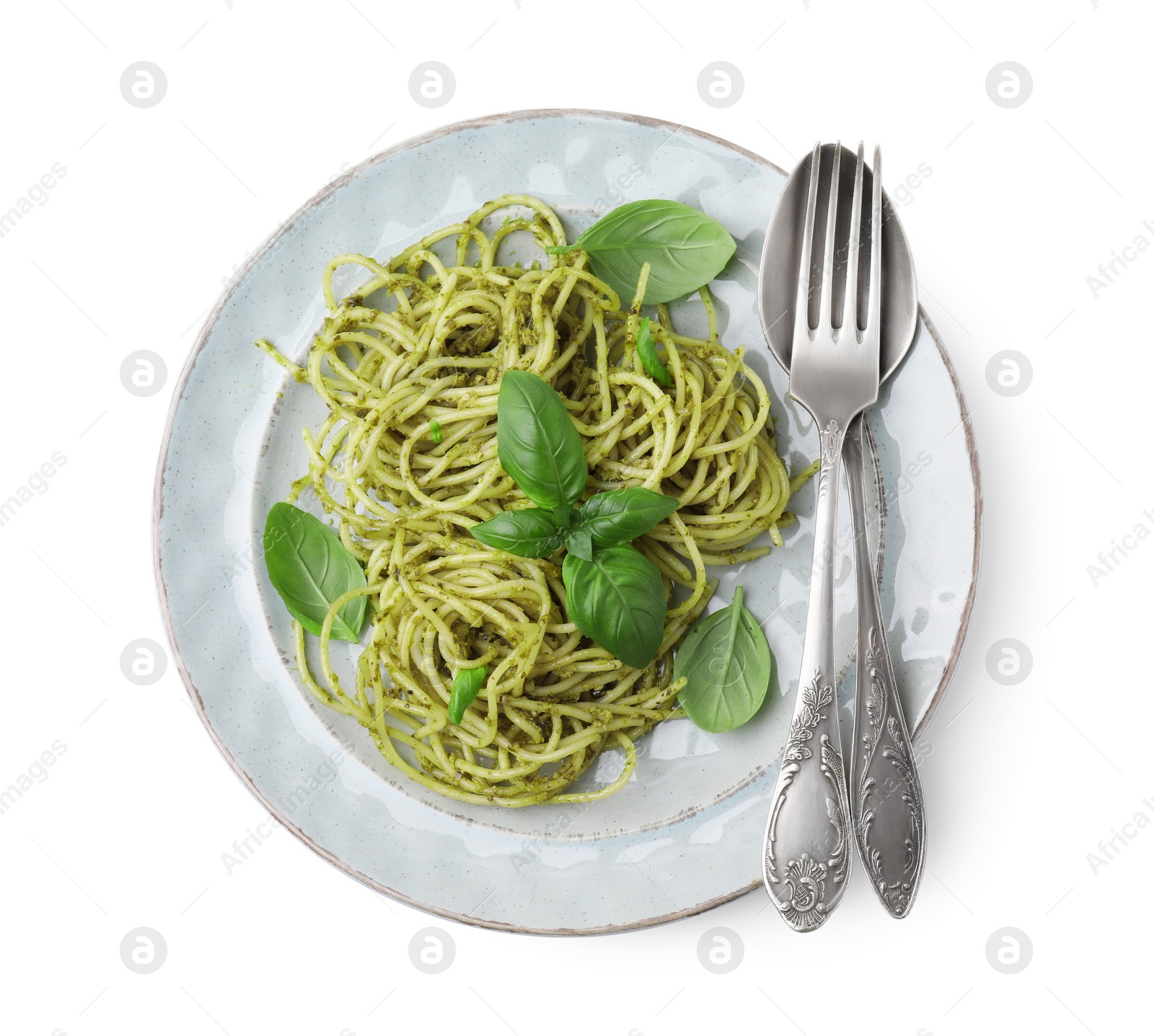 Photo of Delicious pasta with pesto sauce, basil and cutlery on white background, top view