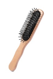 Photo of Wooden brush with lost hair in air on white background