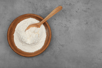 Photo of Flour on light grey background, top view. Space for text