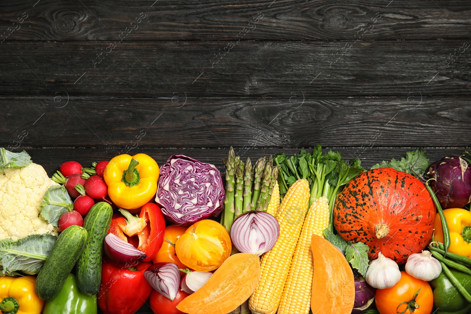 Photo of Flat lay composition with fresh vegetables and space for text on wooden background