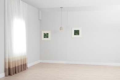 Photo of Empty living room with window. Interior design