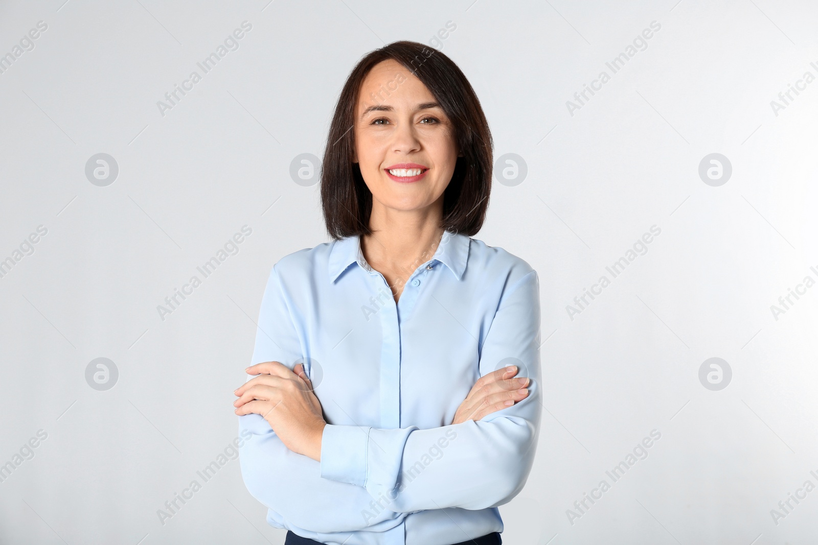 Photo of Portrait of mature businesswoman on white background