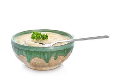 Photo of Bowl with tasty mashed potatoes on white background