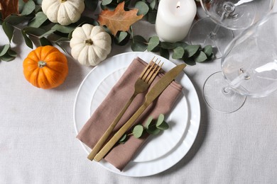 Photo of Beautiful autumn table setting. Plates, cutlery, glasses and decor, flat lay