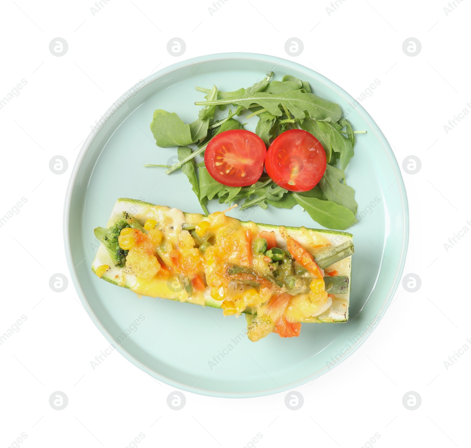 Photo of Plate of baked stuffed zucchini on white background, top view