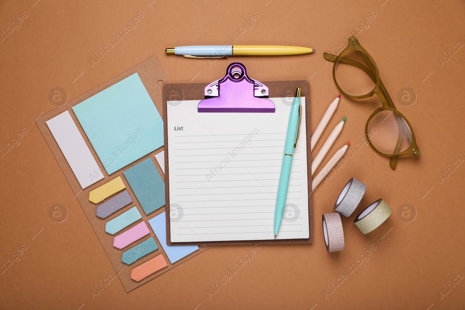 Photo of To do notes, stationery and glasses on brown background, flat lay with space for text. Set for daily planner