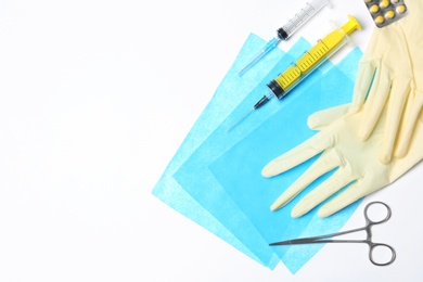 Flat lay composition with medical gloves on white background