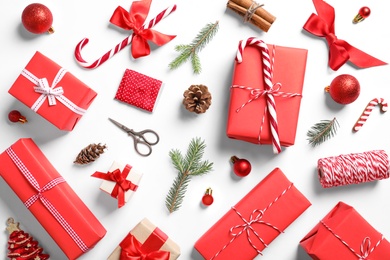 Photo of Flat lay composition with Christmas gifts on white background