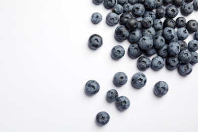 Photo of Flat lay composition with tasty blueberry and space for text on white background