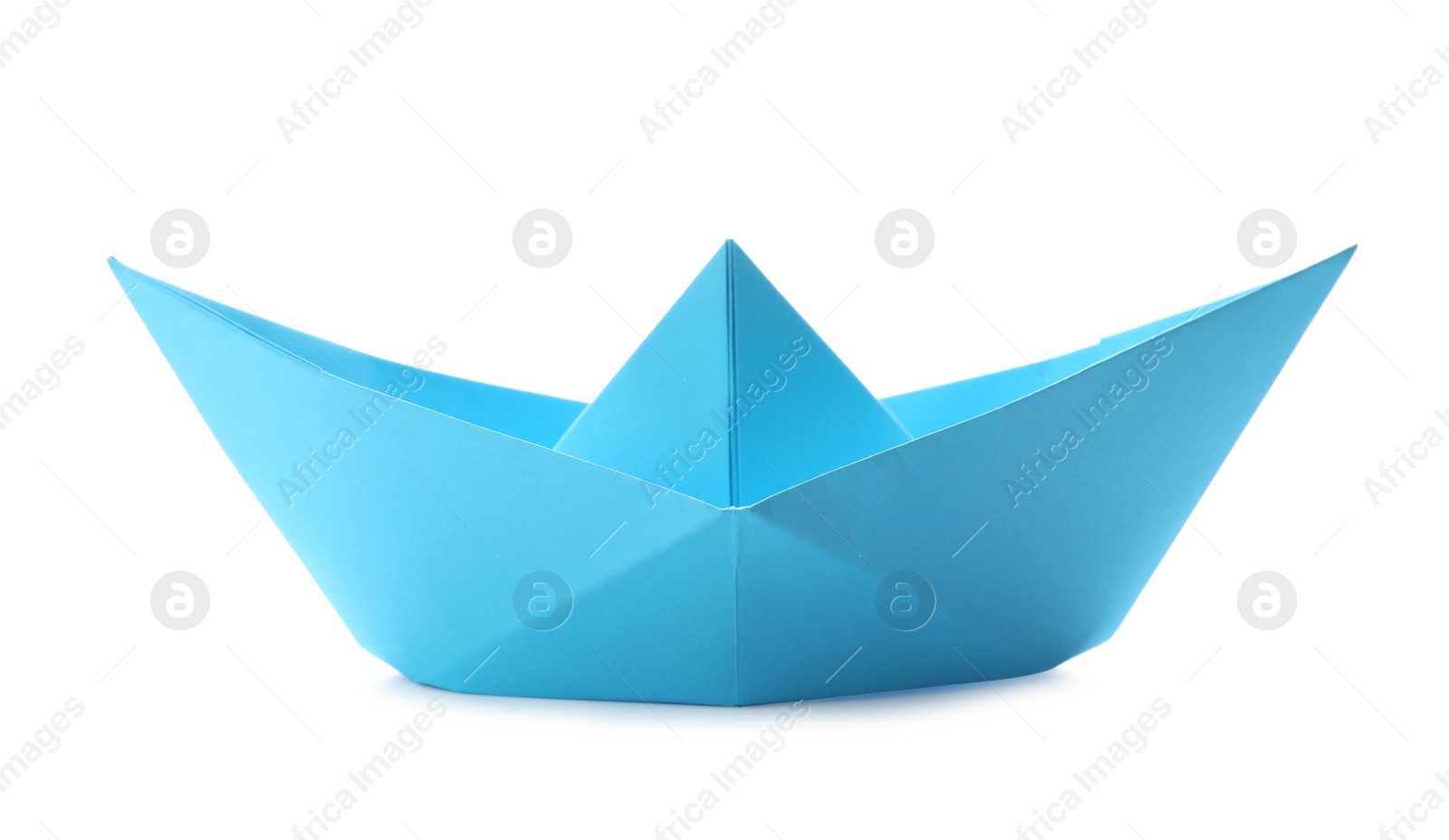 Photo of Handmade light blue paper boat isolated on white. Origami art