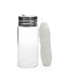 Photo of Roll of natural dental floss and jar on white background