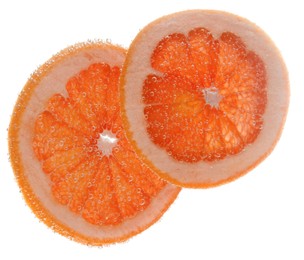 Photo of Slice of grapefruit in sparkling water on white background. Citrus soda