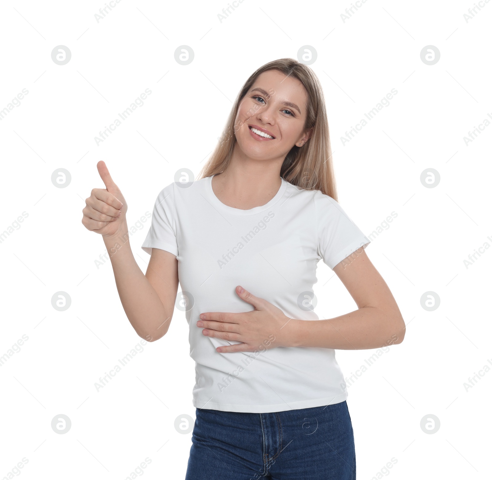 Photo of Happy woman touching her belly and showing thumb up on white background. Concept of healthy stomach