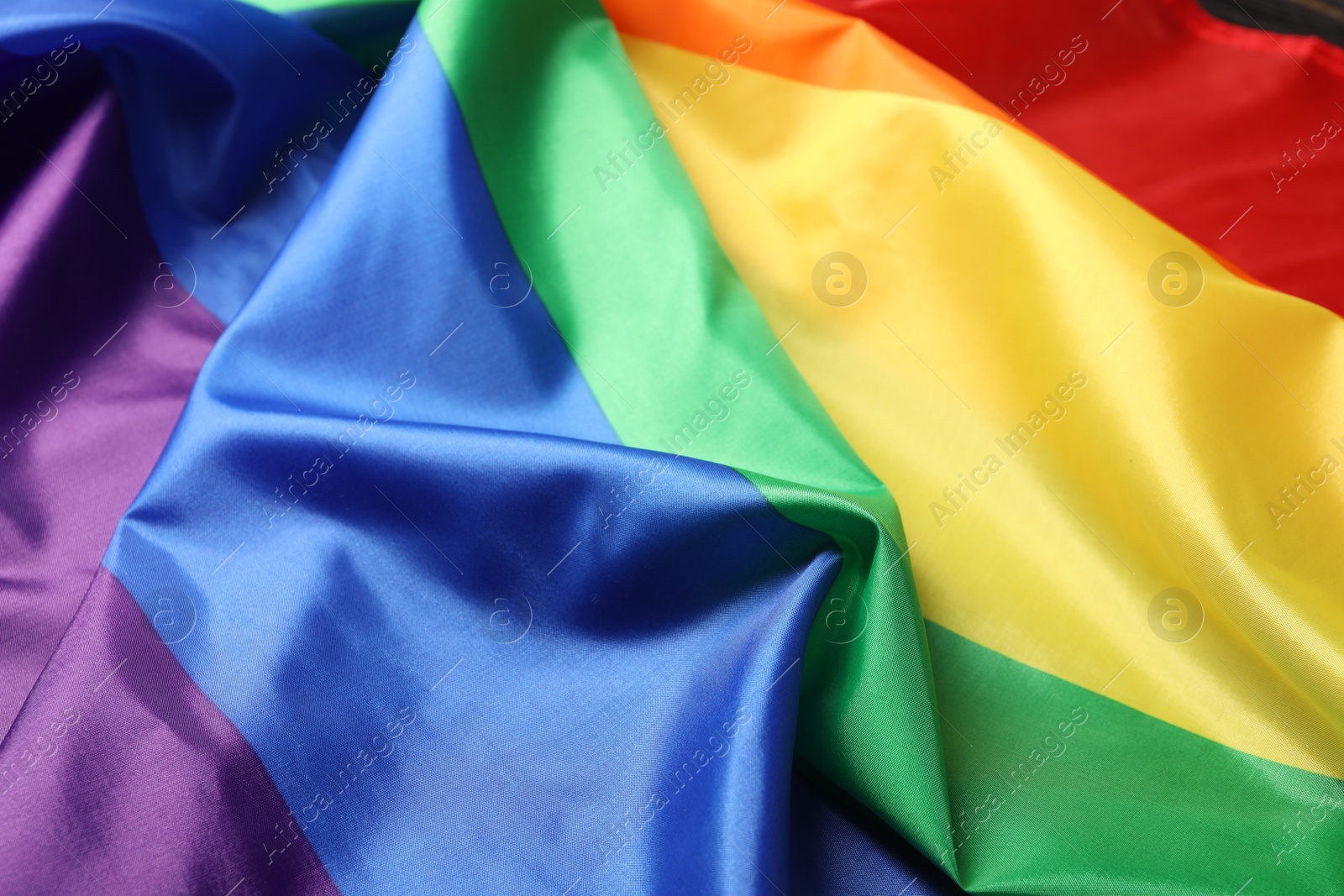 Photo of Rainbow LGBT flag as background, closeup view