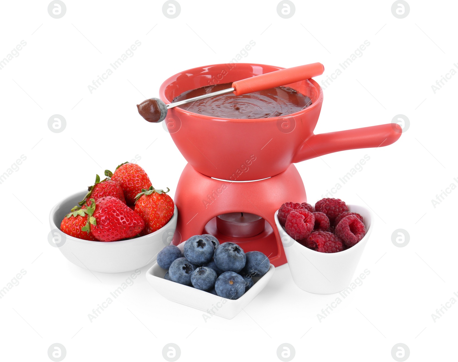 Photo of Fondue pot with melted chocolate, fresh berries and fork isolated on white