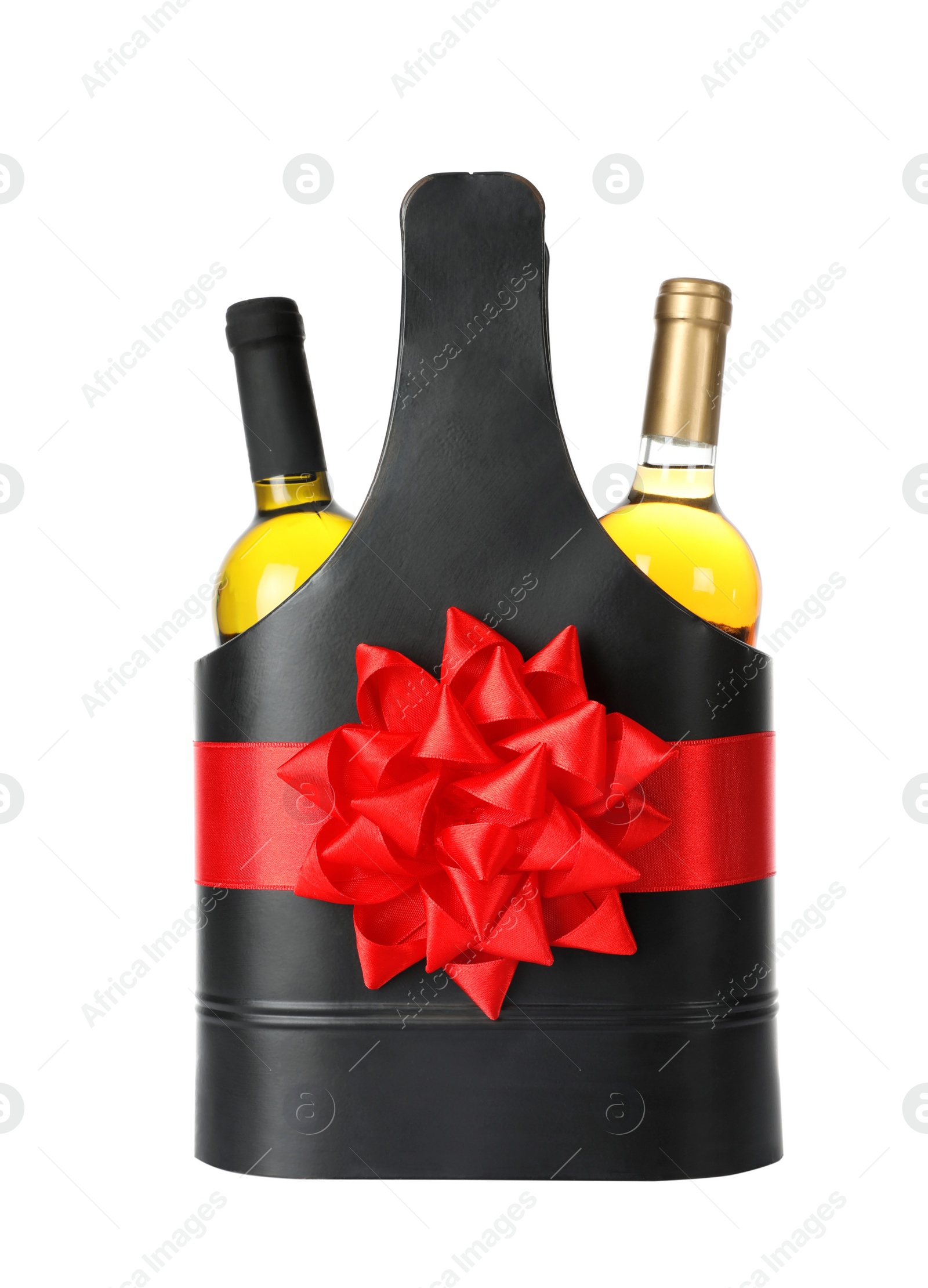 Photo of Wine bottles in festive package with red bow isolated on white