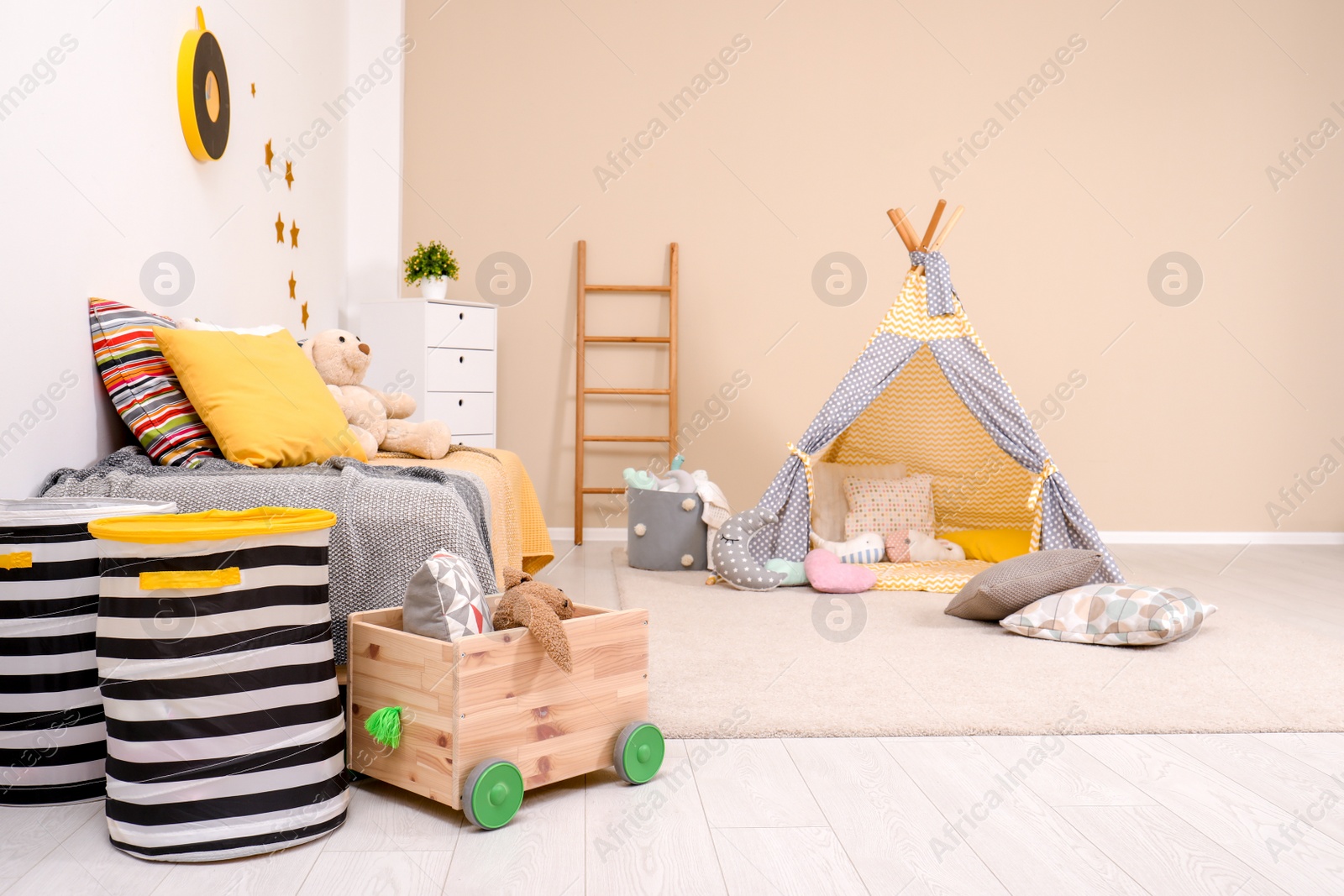 Photo of Cozy child room interior with bed, play tent and modern decor elements