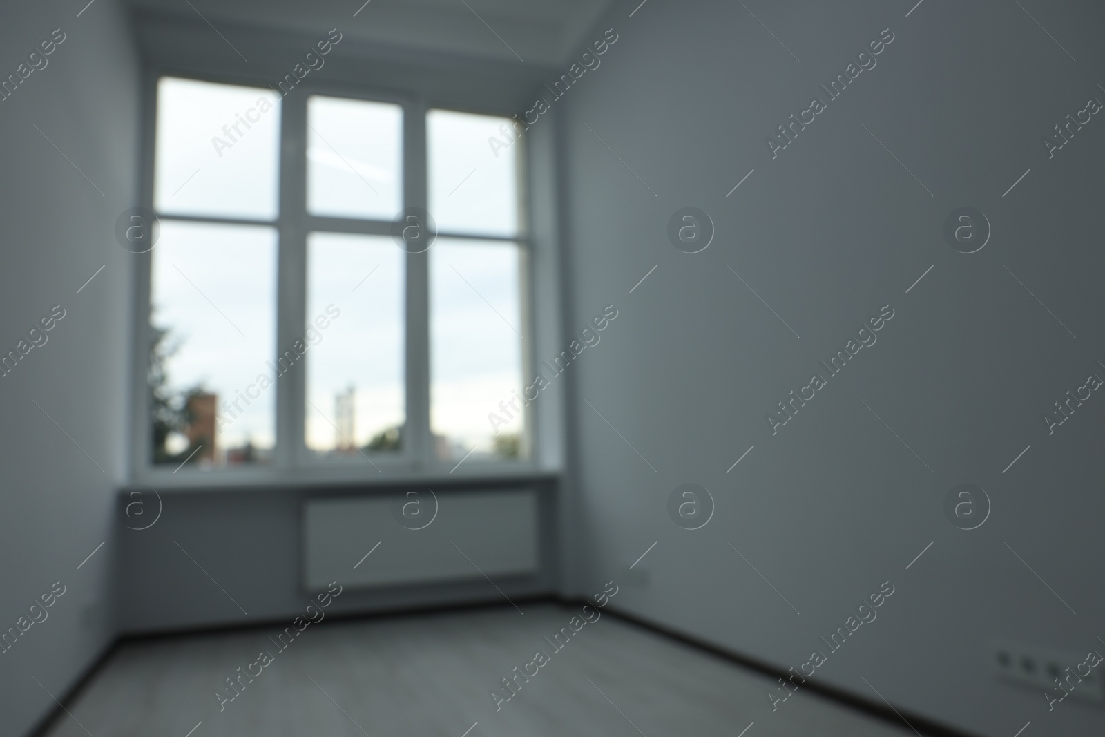 Photo of Blurred view of window in empty renovated room