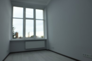 Blurred view of window in empty renovated room