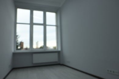 Photo of Blurred view of window in empty renovated room