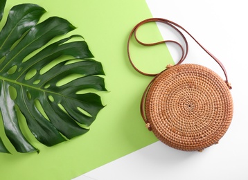 Photo of Flat lay composition with bamboo bag on color background