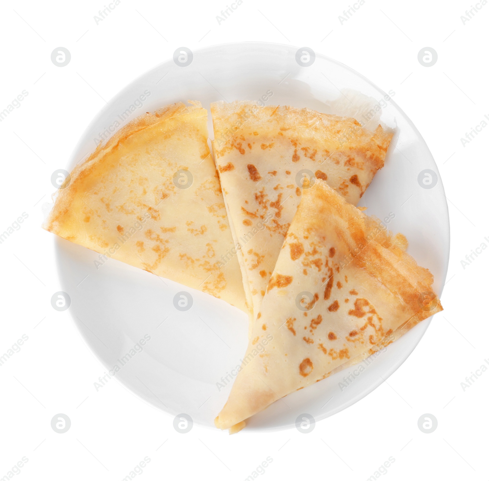 Photo of Tasty thin folded pancakes on plate against white background, top view