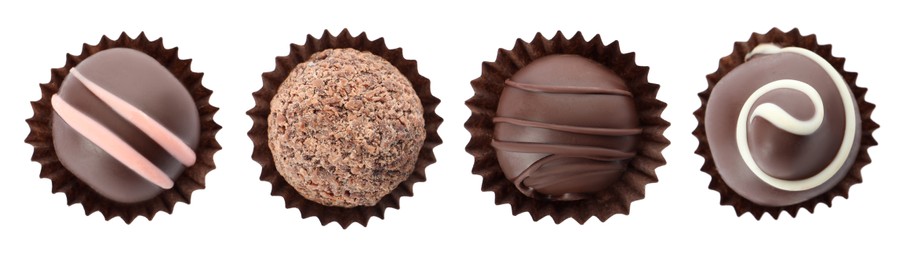 Image of Set with delicious sweet chocolate truffles on white background, top view. Banner design